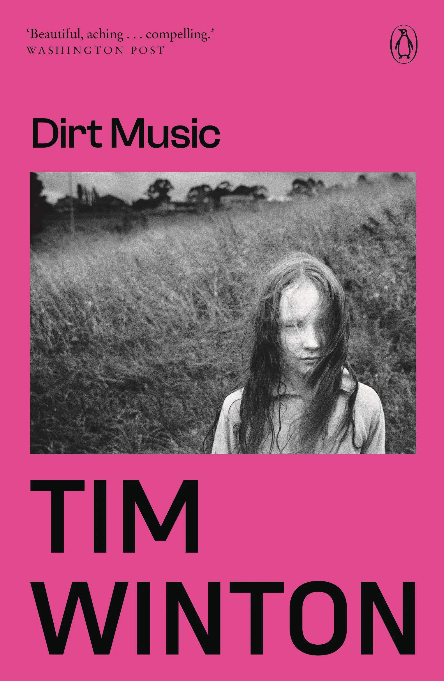 Book cover of Dirt Music by Tim Winton. A pink background with a black and white photo of a young girl.