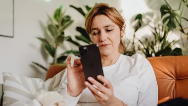 Concerned woman looking at phone