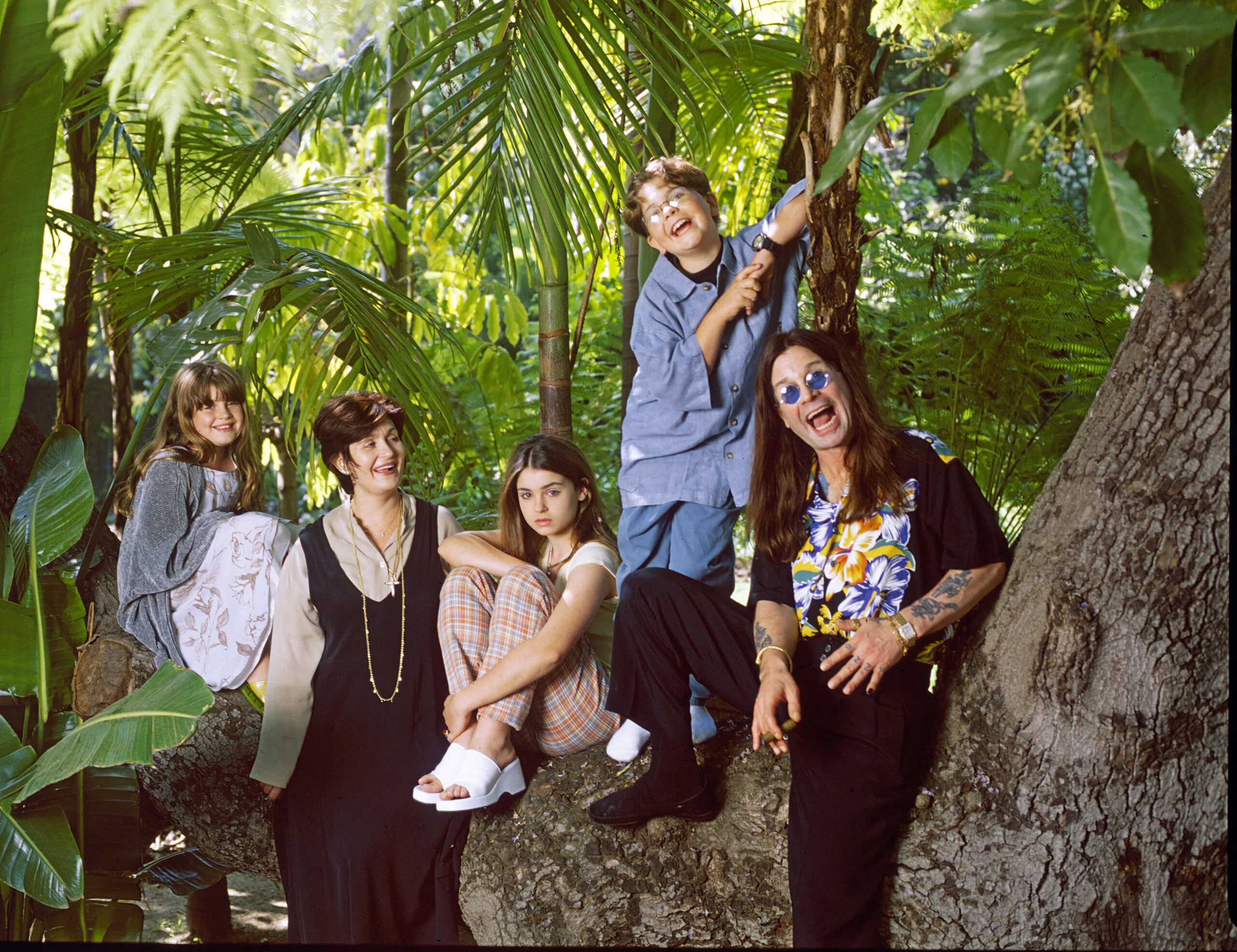 Ozzy Osbourne, former lead singer of Black Sabbath, pictured with his family in the grounds of his luxury home in Coldwater Canyon, Beverly Hills, California in March 1997. Left to right in photo are Aimee, Sharon Osbourne, Kelly, Jack and Ozzy. (Photo by Eddie Sanderson/Getty Images).