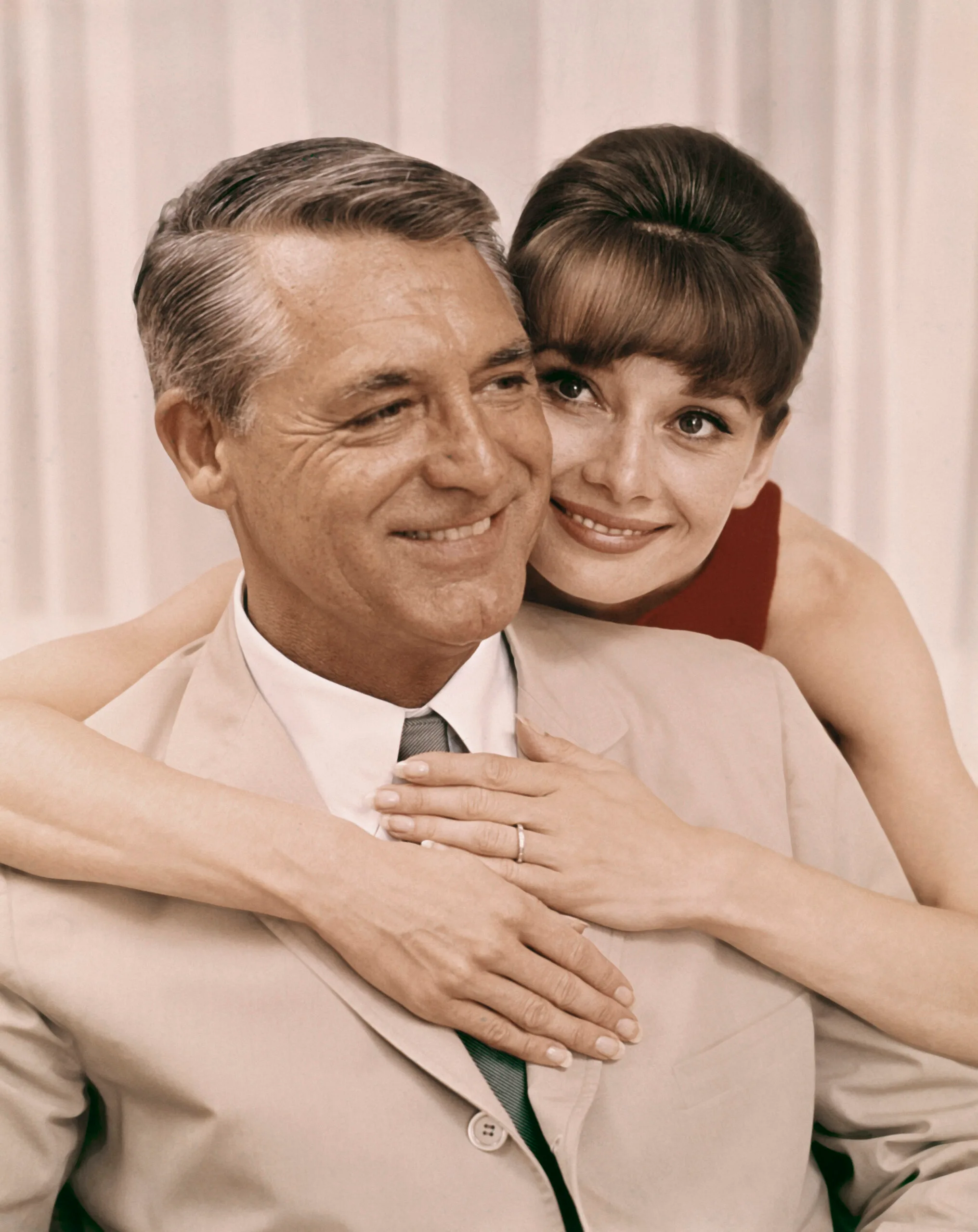'Charade' Audrey Hepburn hugging Cary Grant 1963. (Photo by Screen Archives/Getty Images)