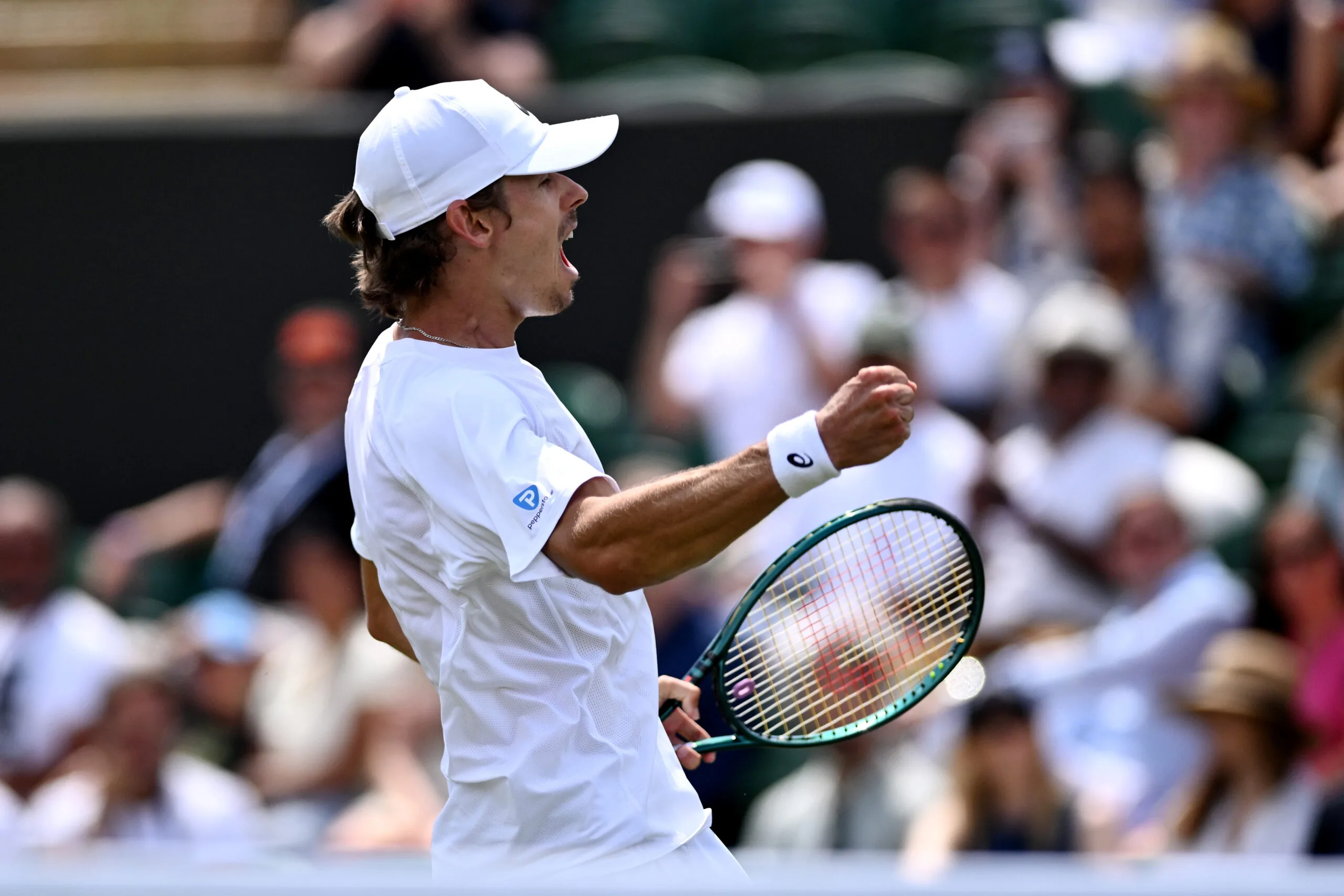 LONDON, ENGLAND - JULY 03: Alex De Minaur of Australia celebrates winning the third set against Arthur Cazaux of France during the Gentlemen's Singles second round match on day four of The Championships Wimbledon 2025 at All England Lawn Tennis and Croquet Club on July 03, 2025 in London, England. (Photo by Mike Hewitt/Getty Images)