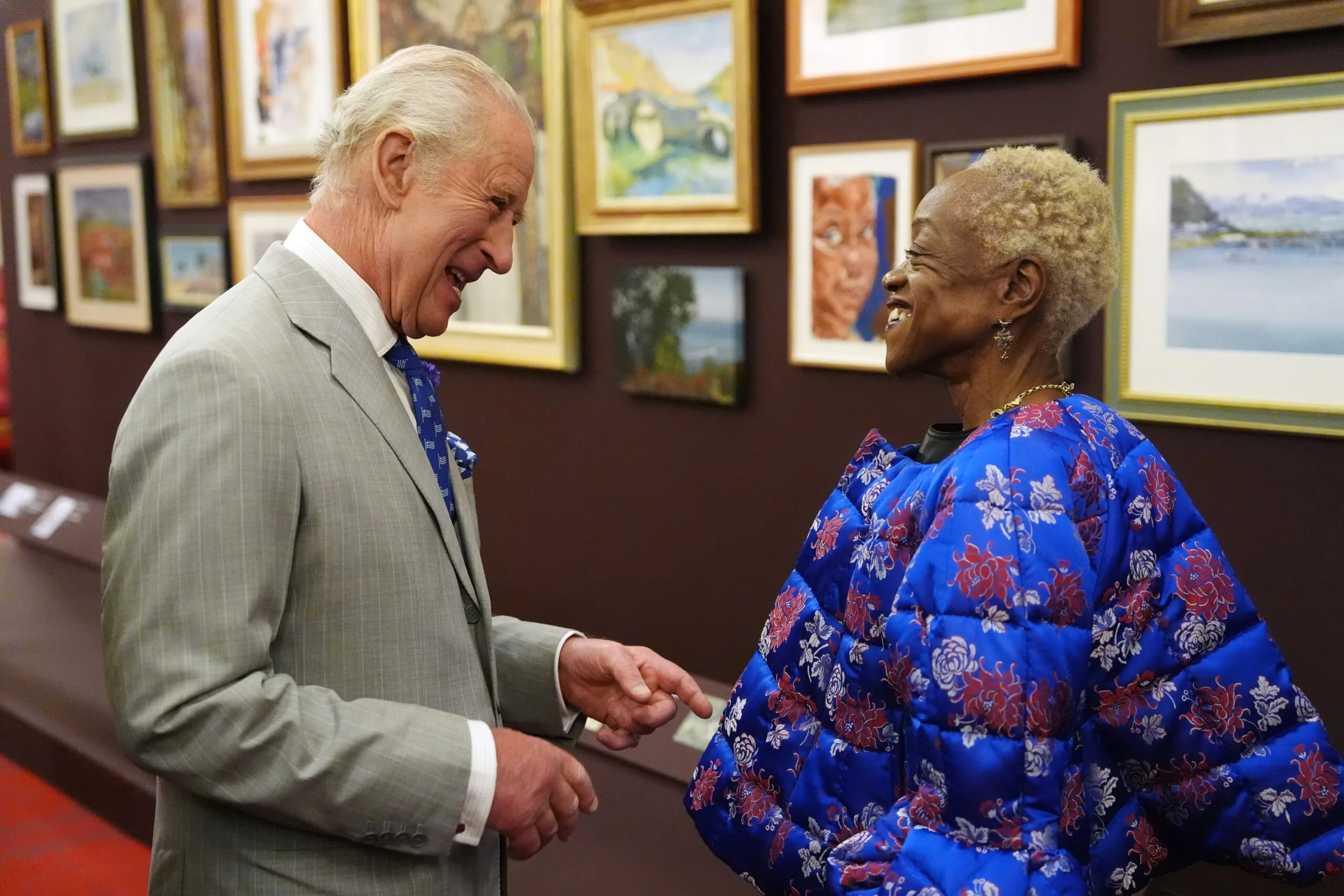 LONDON, ENGLAND - JULY 9: King Charles III speaks with Claudette Johnson at the King's Tour Artists exhibition, during a reception for the King's Tour Artists exhibition celebrating 40 years of artists accompanying official overseas visits at Buckingham Palace, on July 9, 2025 in London, England. (Photo Jonathan Brady - WPA Pool/Getty Images)