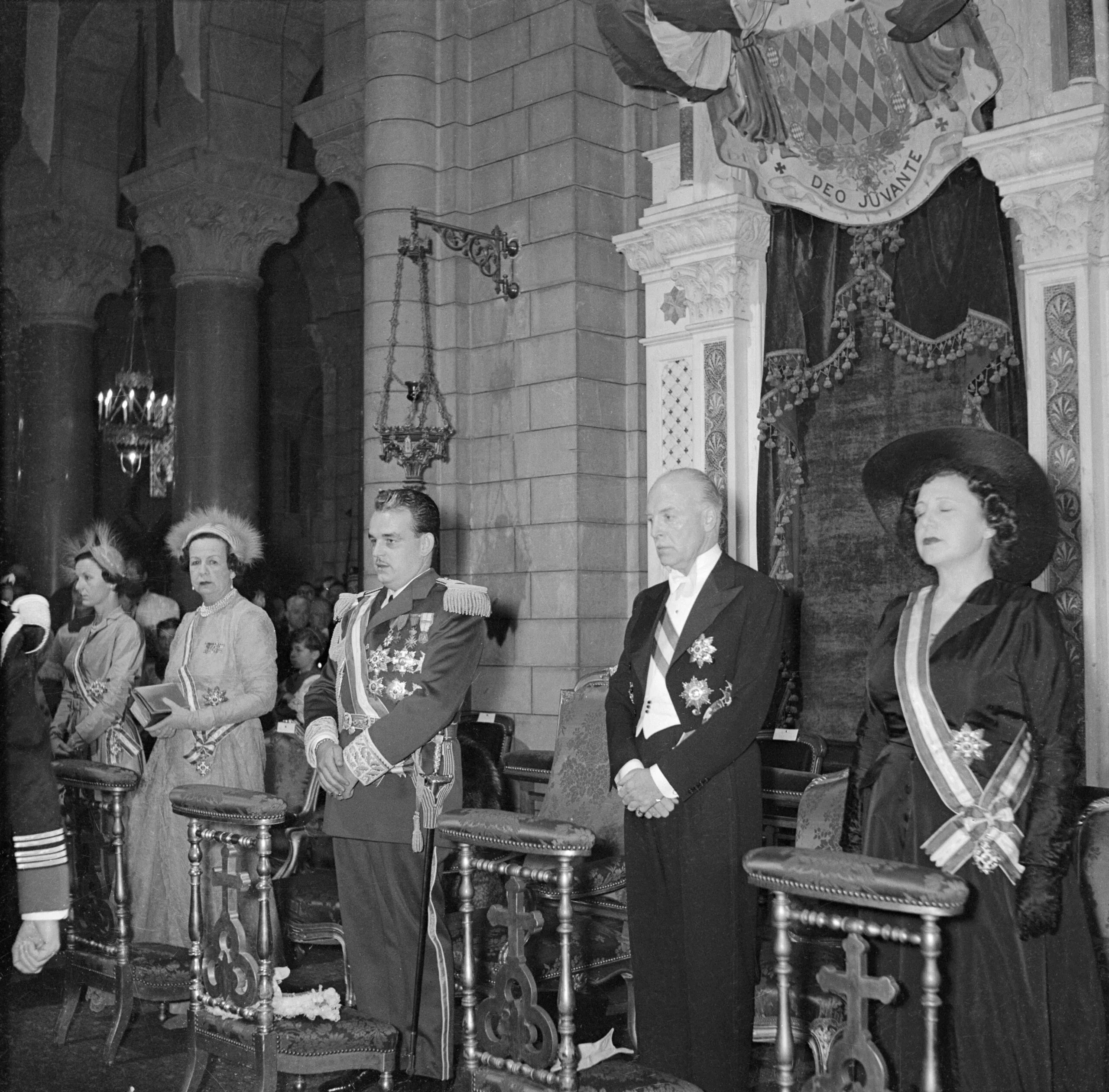 
(Original Caption) Monaco's ruler ascends throne. Monaco: Prince Rainier III (center), 26, who last November officially succeeded his late grandfather, Prince Louis II, as ruler of Monaco, is flanked by members of the Royal family during enthronement ceremonies held this week. Others (from left) are: Princess Antoinette of Monaco; Princess Charlotte, the ruler's mother; Prince Pierre and Princess Ghislaine. The tiny principality, located on a peninsula in the Mediterranean, celebrated with five days of colorful festivities.