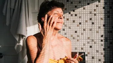 woman applying skincare