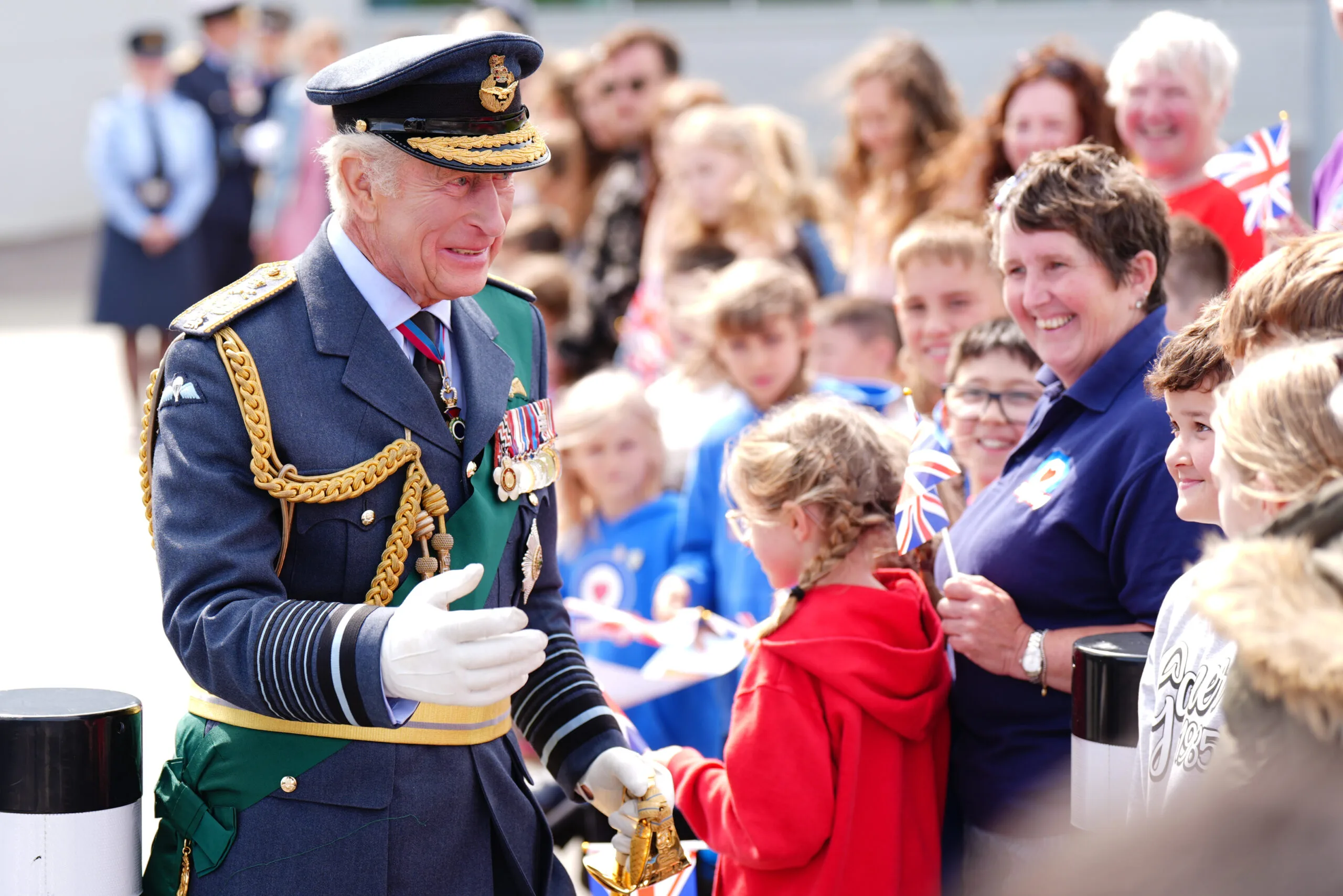LOSSIEMOUTH, SCOTLAND - AUGUST 6: King Charles III meets RAF soldiers and their families, during a visit to RAF Lossiemouth in Moray to re-present a Squadron Standard on August 6, 2025 in Lossiemouth, Scotland. (Photo by Jane Barlow - WPA Pool/Getty Images)