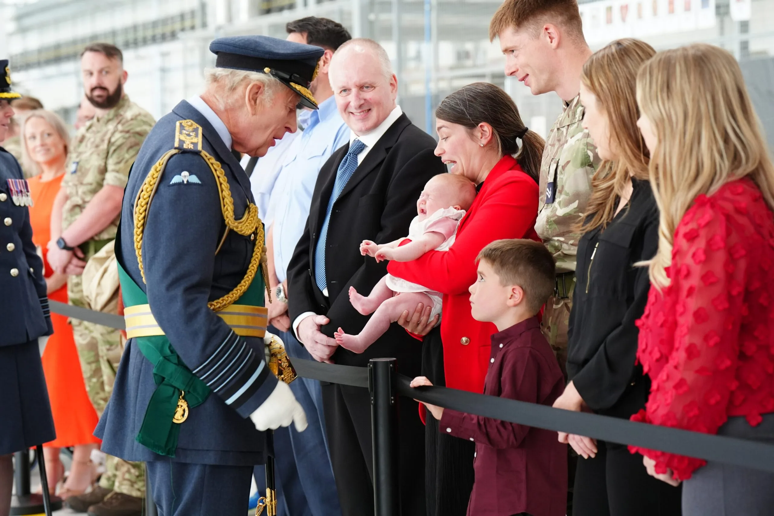 LOSSIEMOUTH, SCOTLAND - AUGUST 6: King Charles III meets RAF soldiers and their families, during a visit to RAF Lossiemouth in Moray to re-present a Squadron Standard on August 6, 2025 in Lossiemouth, Scotland. (Photo by Jane Barlow - WPA Pool/Getty Images)
