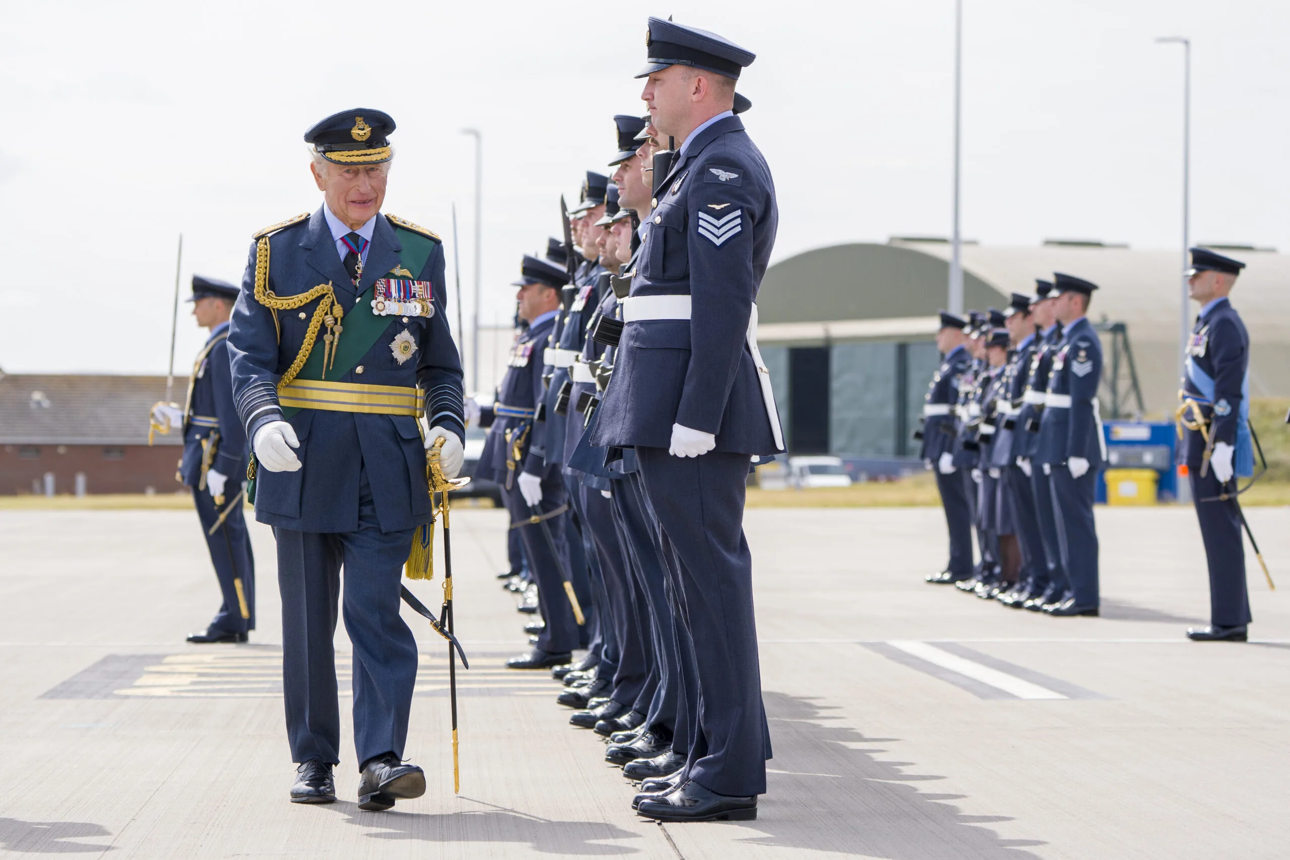 LOSSIEMOUTH, SCOTLAND - AUGUST 6: King Charles III inspects members of 42 (Torpedo Bomber) Squadron during a visit to RAF Lossiemouth in Moray, to re-present the Squadron Standard on August 6, 2025 in Lossiemouth, Scotland. (Photo by Jane Barlow - WPA Pool/Getty Images)

