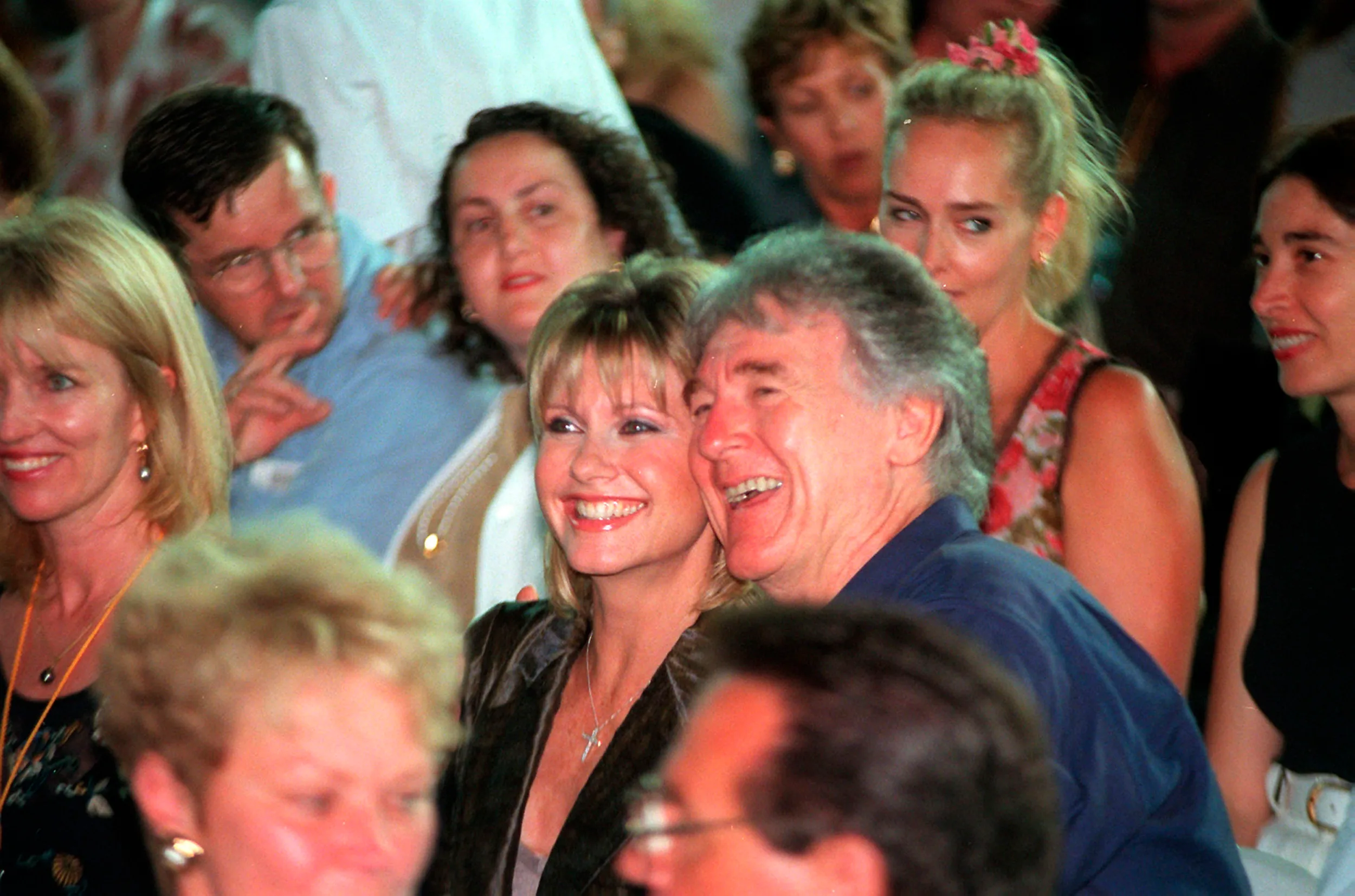 SYDNEY, AUSTRALIA - MARCH 1999:  Olivia Newton John and Col Joye pictured during the "One Night Only" concert at Stadium Australia in Sydney, Australia. (Photo by Patrick Riviere/Getty Images)
