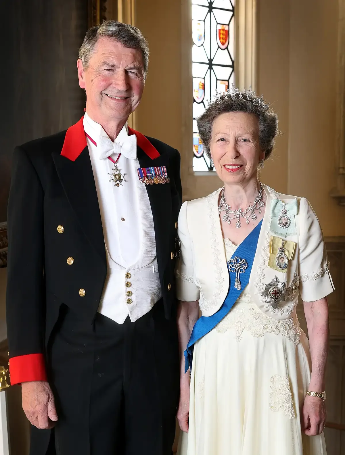Princess Anne and her husband Vice Admiral Sir Tim Laurenece appear in their full royal regalia for a state banquet dinner.