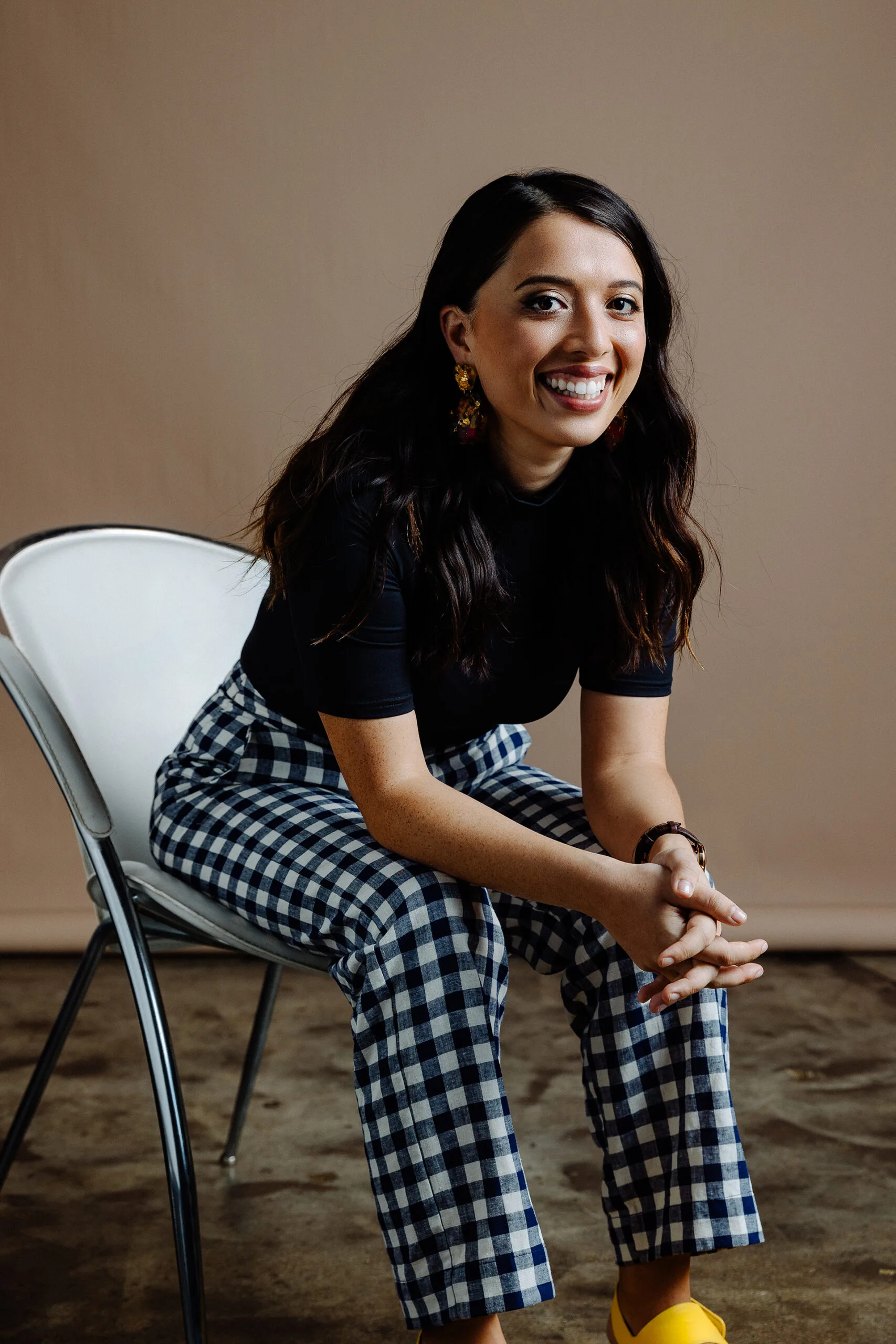 Pub Choir creator Astrid Jorgensen sits on a chair