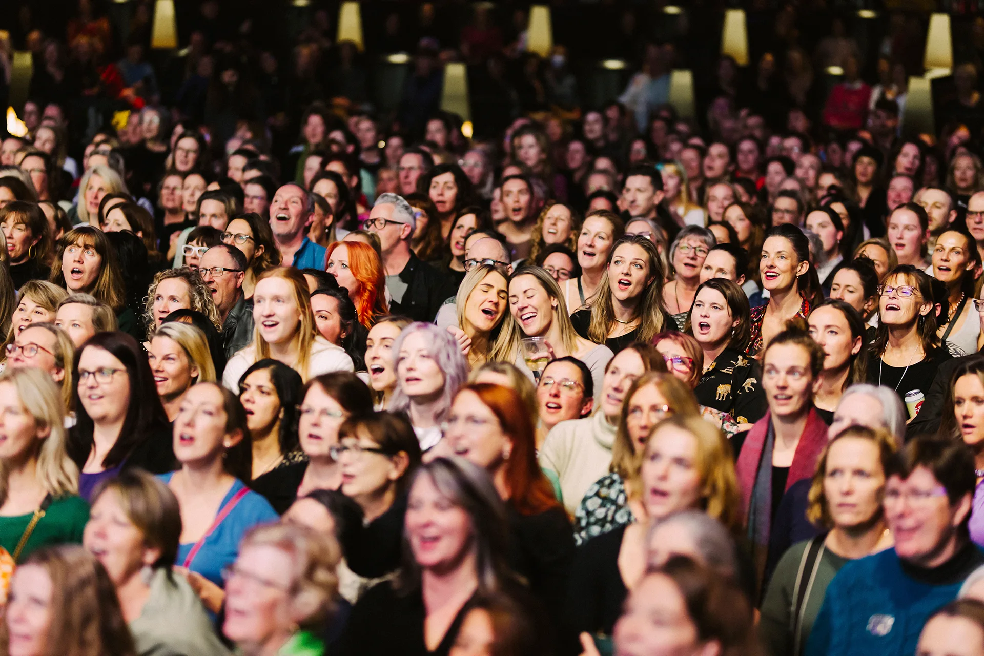 A crowd of people singing at Pub Choir