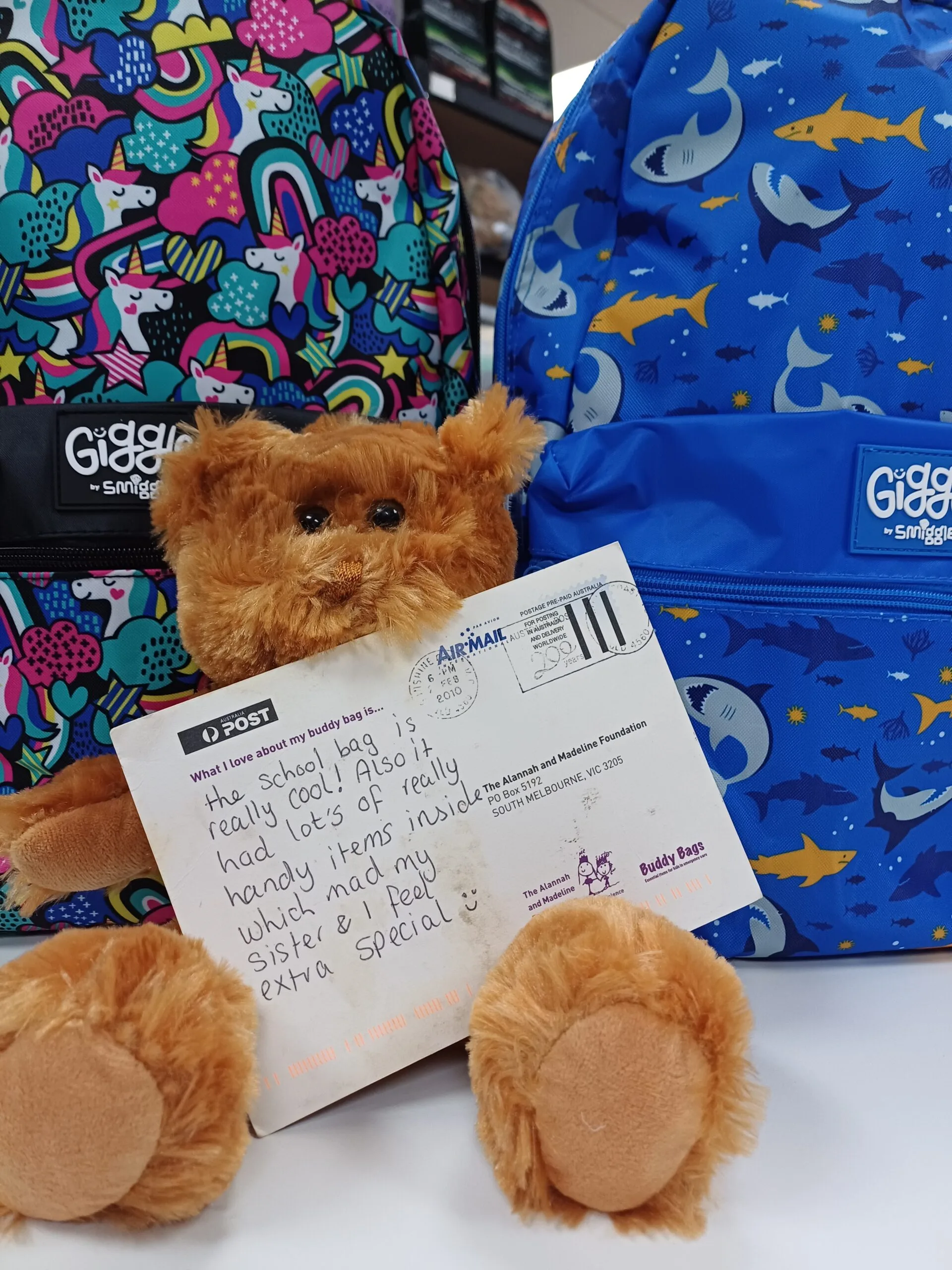 A thank yu card from a Buddy Bag recipient reads: 'The school bag is really cool! Also it has lots of really handy items inside, which made my sister and I feel extra special'.