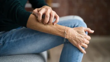 Women scratching arm