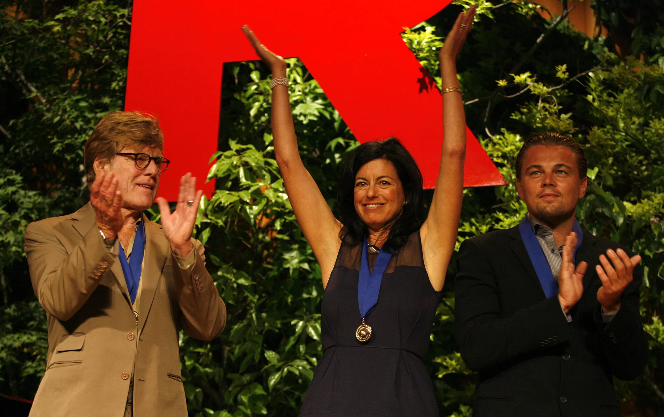 BEVERLY HILLS, CA - APRIL 25: (L-R) Actor Robert Redford, Laurie David and actor Leonardo DiCaprio onstage at the Natural Resources Defense Council's 20th Anniversary Celebration at the Beverly Wilshire Hotel on April 25, 2009 in Beverly Hills, California. (Photo by Jeff Vespa/WireImage)