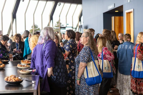 A group of people standing together at the romance writers of Australia conference