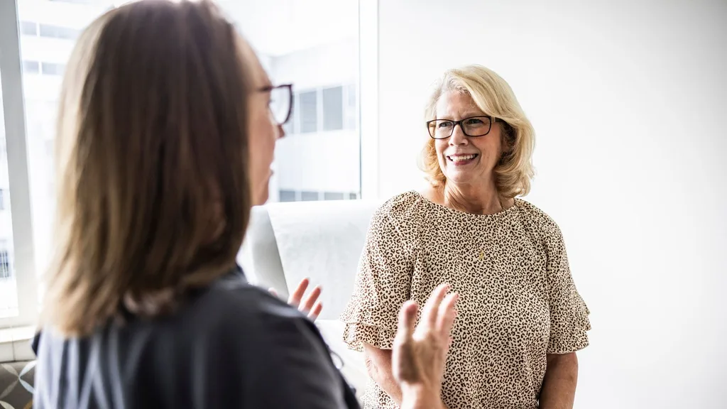 Mature woman talking to doctor