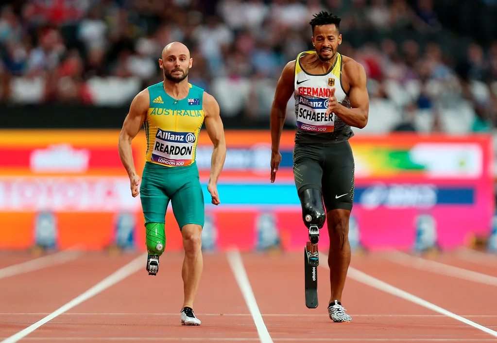 Scott Reardon at the World Para Athletics Championships with a competitor