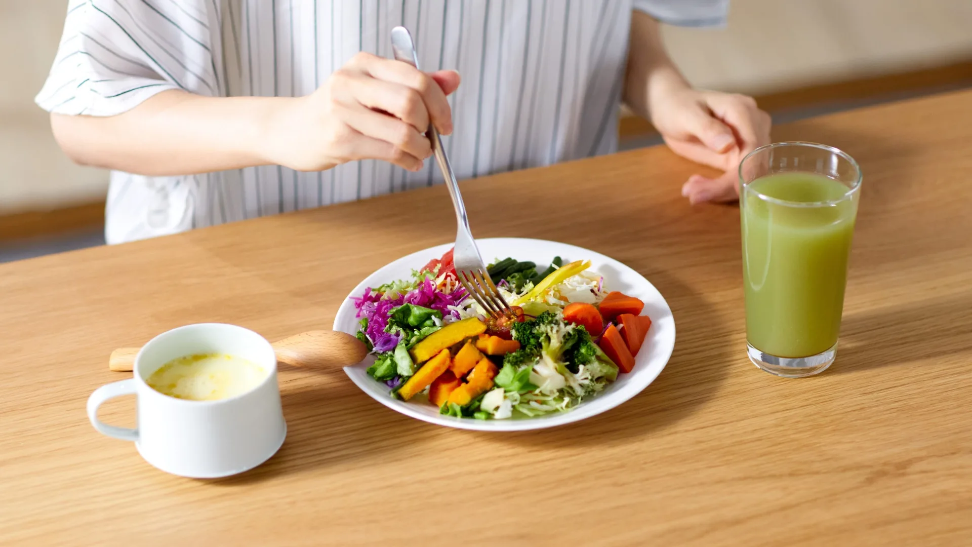 Woman eating salad