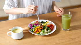 Woman eating salad