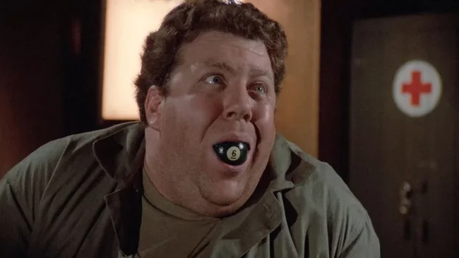 MASH, Trick or Treatment. A man has a pool ball in his mouth.