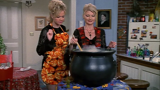 Tow women stirring a cauldron in a kitchen. Sabrina the Teenage Witch episode still.