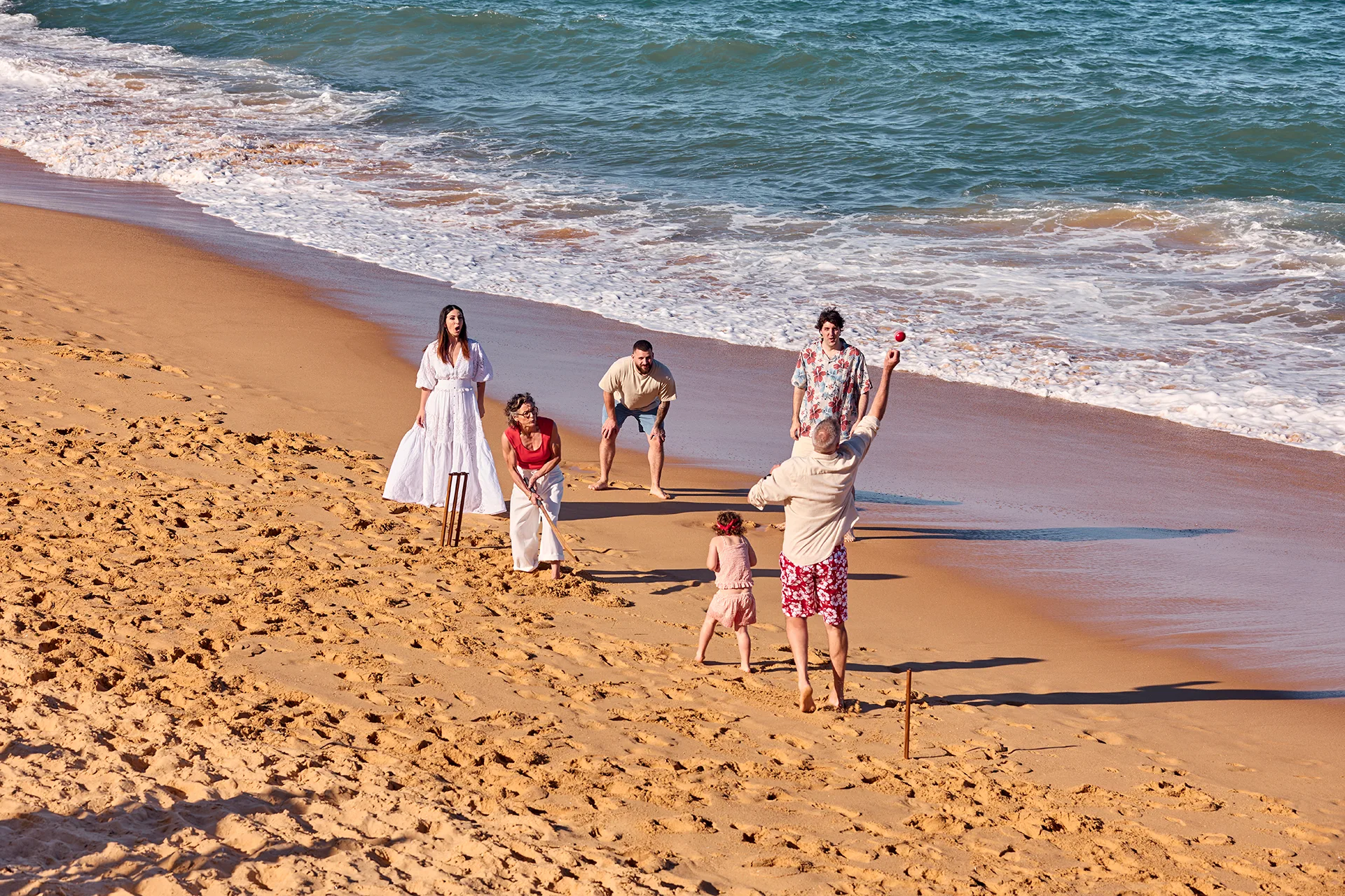 Julie Goodwin and her family playing cricket on the beach Photography by Peter Brew-Bevan