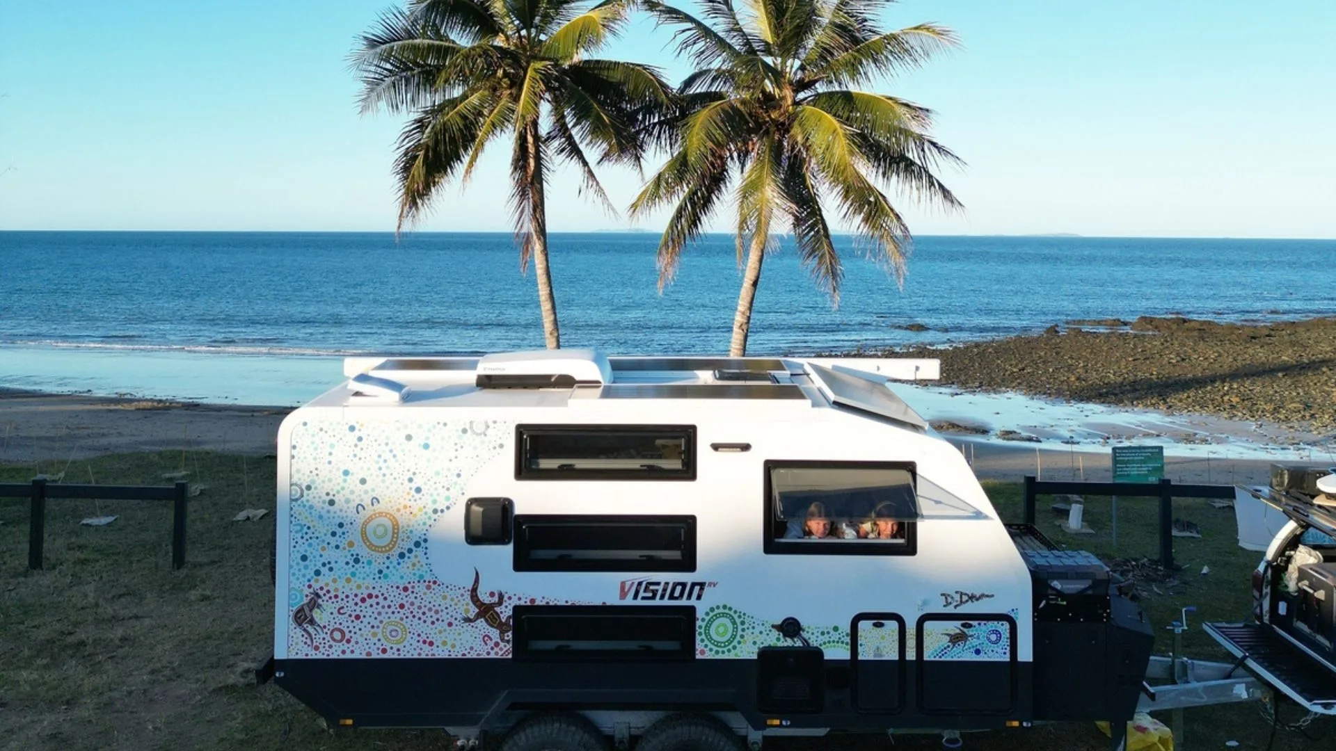 Camplify caravan hire - a van at the beach
