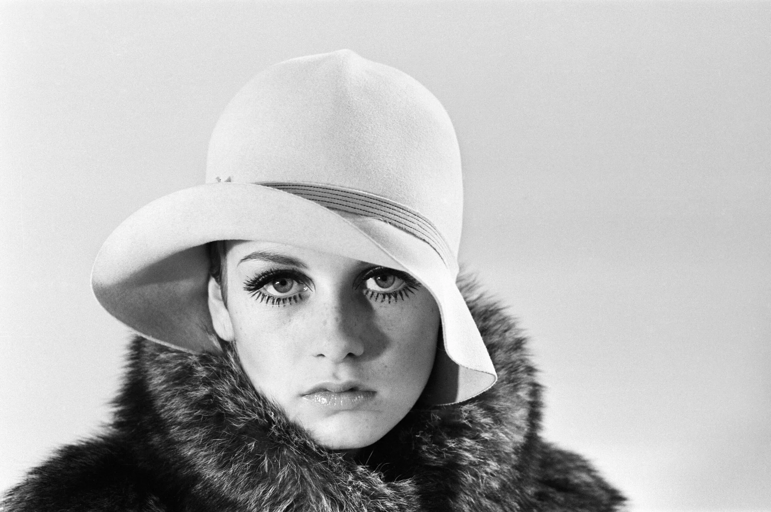 Model Twiggy posing in the studio wearing a hat. December 1966. (Photo by Daily Herald/Mirrorpix/Mirrorpix via Getty Images)