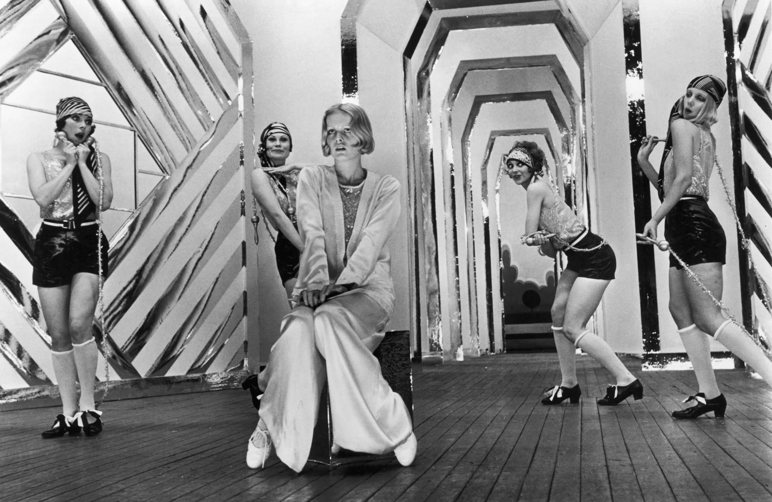 English model and actress Twiggy as Polly Browne with dancers in a scene from the fim version of Sandy Wilson's musical 'The Boy Friend', directed by Ken Russell, 1971. Left to right: Caryl Little, Antonia Ellis, Twiggy, Sally Bryant and Georgina Hale. (Photo by MGM Studios/Hulton Archive/Getty Images)