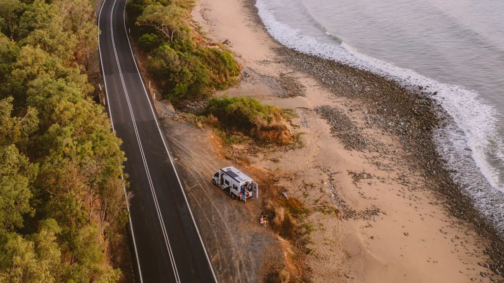 Star RV campervan in North Queensland NSW Australia, on the beach with a road next to it