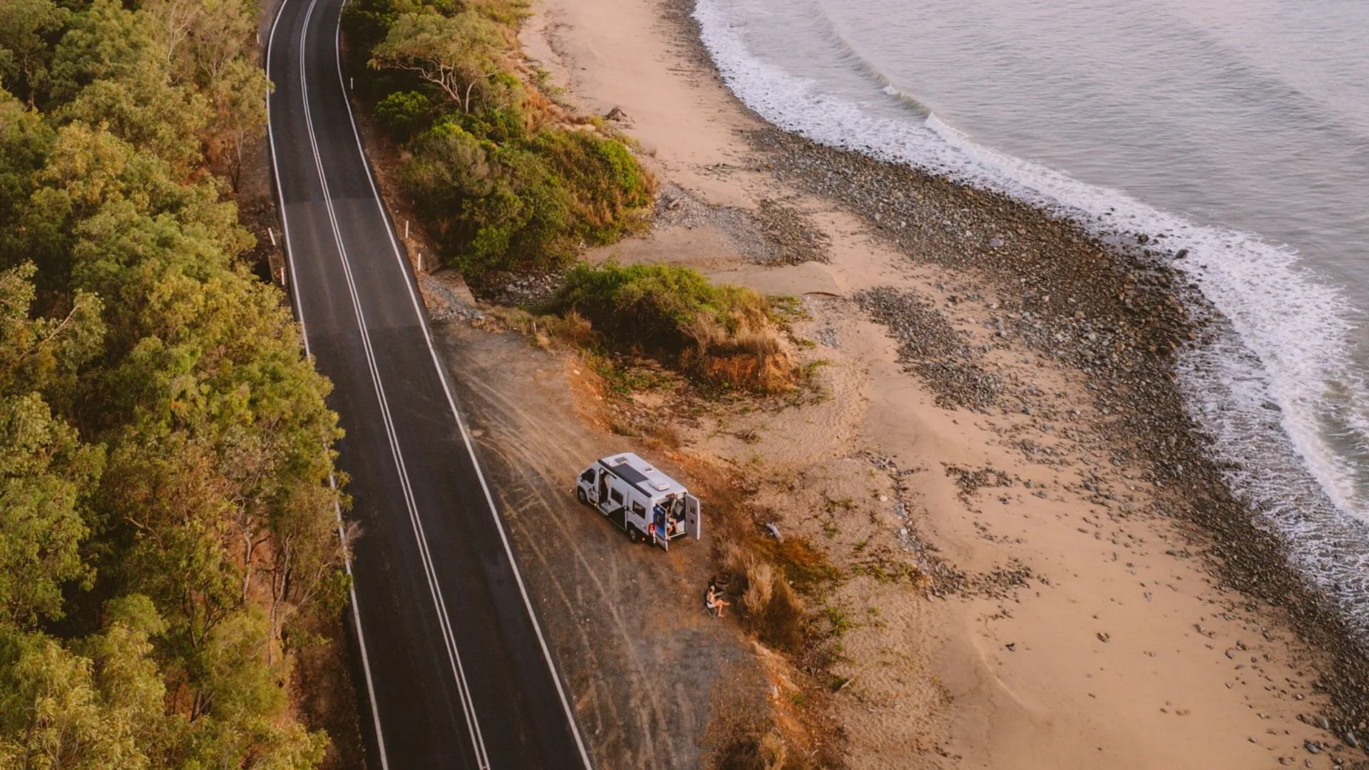 Star RV campervan in North Queensland NSW Australia, on the beach with a road next to it
