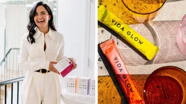 A split image. On the left, Anna Lahey, founder of Vida Glow, is smiling and holding a Vida Glow product box while wearing a white collared jumpsuit with a black belt. Several other Vida Glow boxes are displayed on a white table next to her. On the right, a close-up overhead shot shows a yellow pineapple-flavored Vida Glow sachet and a red/orange sachet resting on a textured surface next to glasses containing colourful liquids.