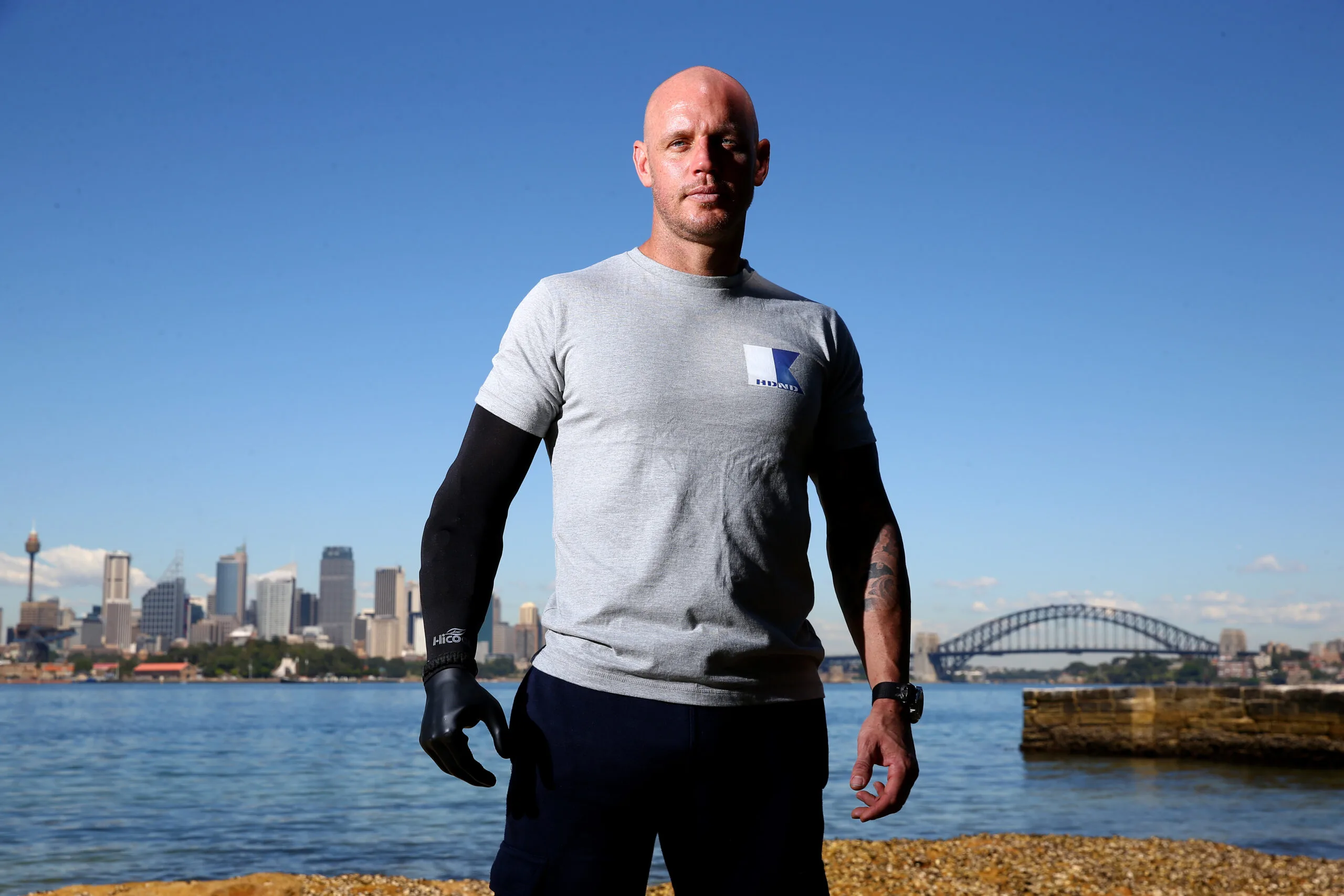 SYDNEY, AUSTRALIA - NOVEMBER 13:  Paul de Gelder poses on Sydney Harbour on November 13, 2013 in Sydney, Australia. Motivational speaker, author and Navy Reserve, Paul de Gelder, 36, lost both an arm and a leg when he was attacked by a male bull shark during an anti-terrorism exercise working as a Navy Clearance Diver with the Royal Australian Navy in Sydney Harbour in February 2009. De Gelder now travels Australia as a motivational speaker and shares his story to inspire others to overcome adversity. Paul is currently on location in South Australia monitoring the behaviour of Great White Sharks with scientists producing a documentary for Discovery Channel.  (Photo by Cameron Spencer/Getty Images)