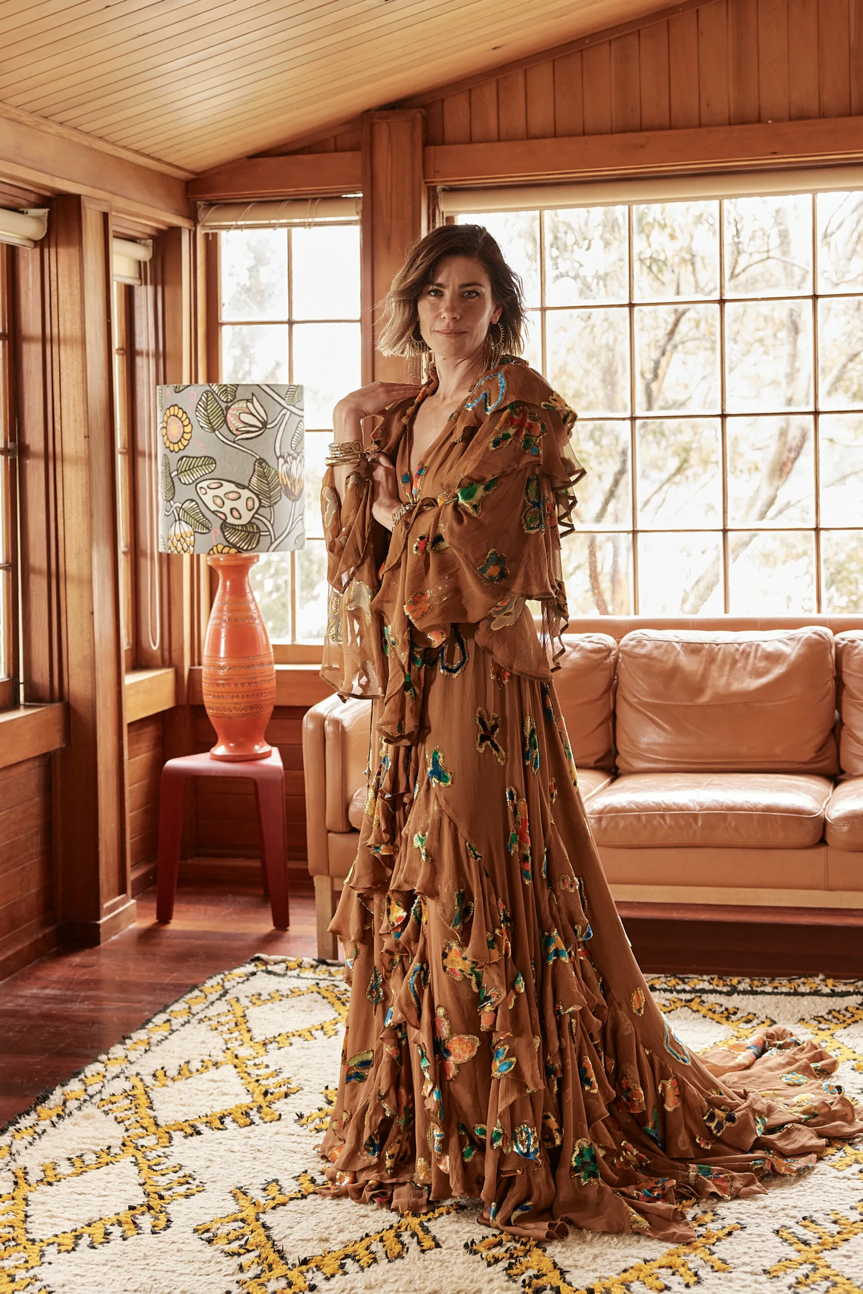 Brooke Satchwell standing in front of mirror. 
Photography by Corrie Bond