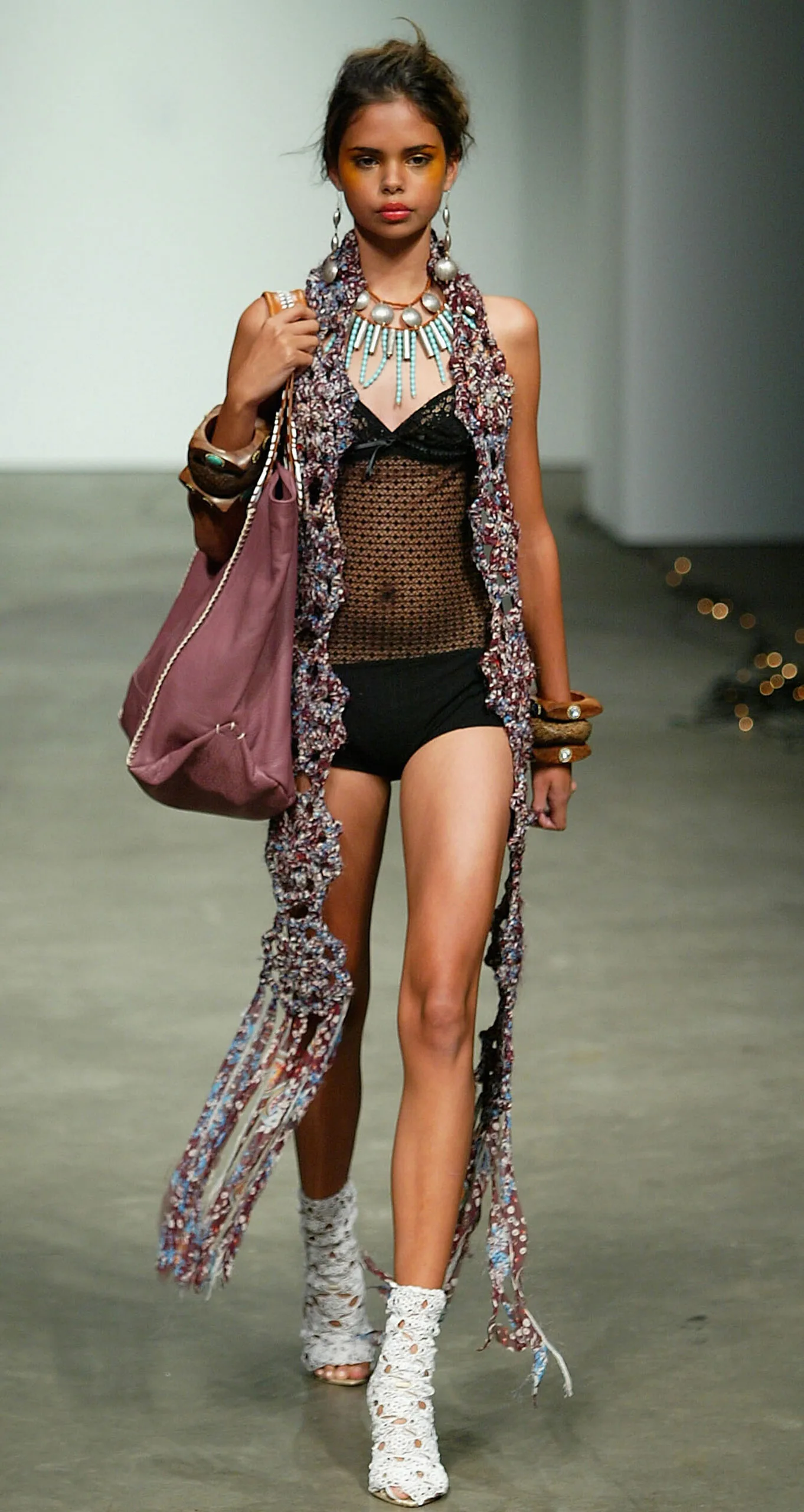 SYDNEY, AUSTRALIA - MAY 2: Model Samantha Harris walks down the runway during the Mimco Collection show at the Cargo Hall in the Overseas Passenger Terminal during the Mercedes Australian Fashion Week on May 2, 2005 in Sydney, Australia. (Photo by Mark Nolan/Getty Images)