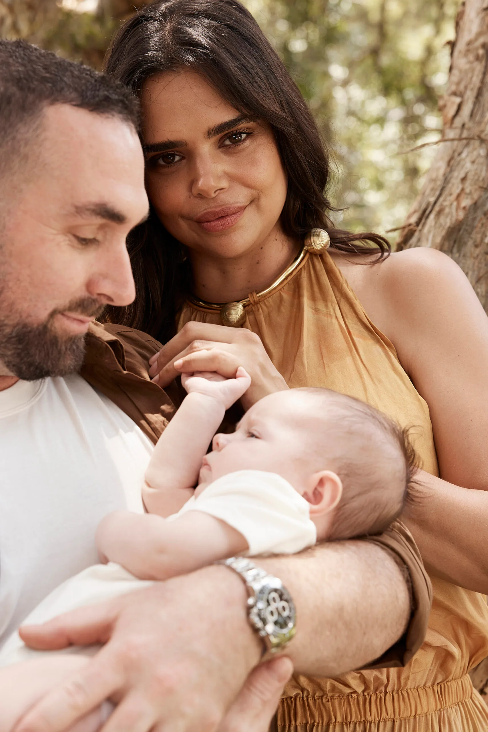 Luke Hunt, Samantha Harris and their baby Bella. Photography by Corrie Bond