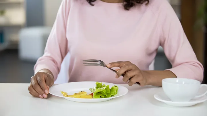 Woman eating salad