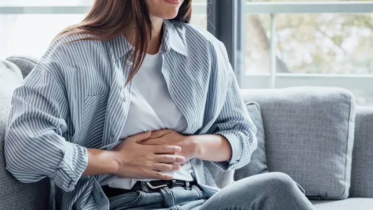 Woman holding stomach