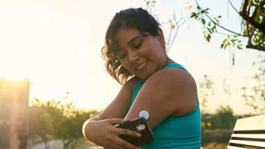 Woman with diabetes glucose monitor