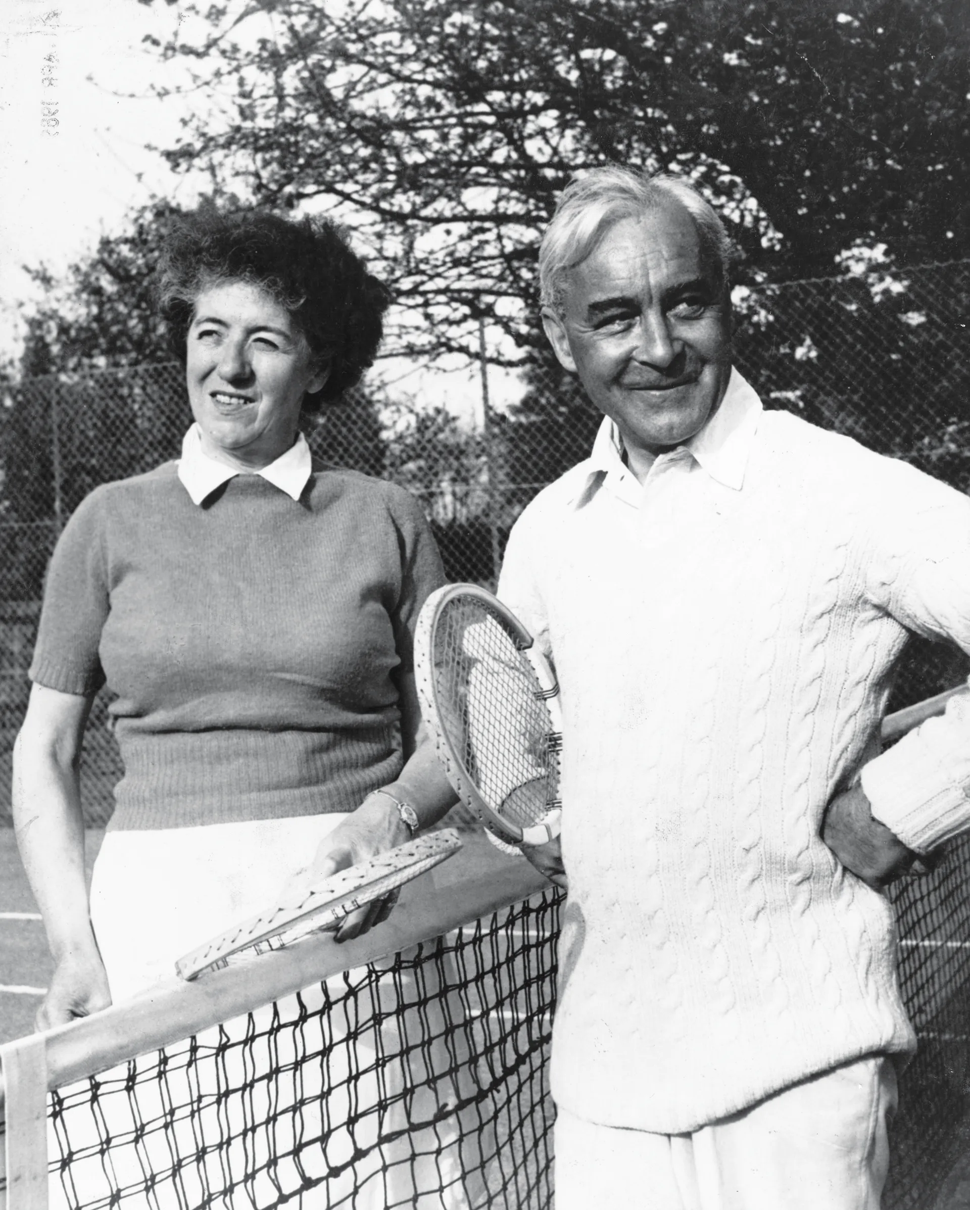 1949:  English children's author Enid Blyton and her husband Kenneth Waters relax during a game of tennis.  (Photo by George Konig/Keystone Features/Getty Images)