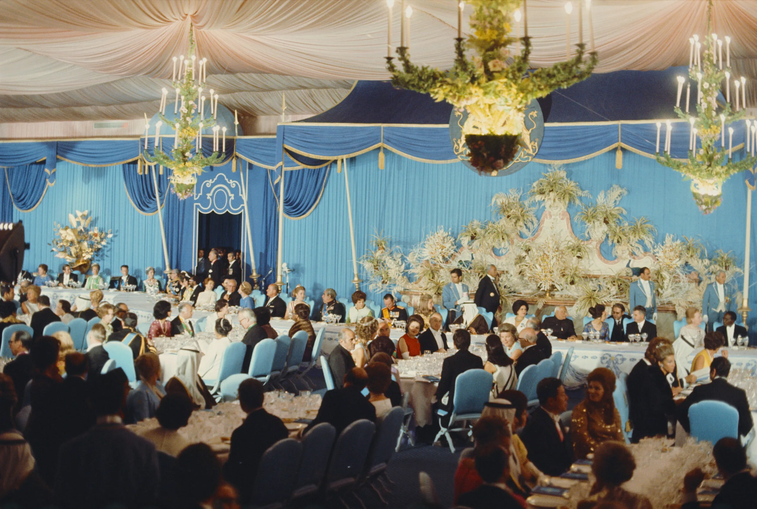 View of a host of world leaders, heads of state, royalty and dignitaries invited by Shah of Iran Mohammad Reza Pahlavi and assembled in a large tent for a banquet during celebrations to commemorate the 2500th anniversary of the Persian Empire amid the ruins of the city of Persepolis in Iran in October 1971. (Photo by Rolls Press/Popperfoto via Getty Images/Getty Images)