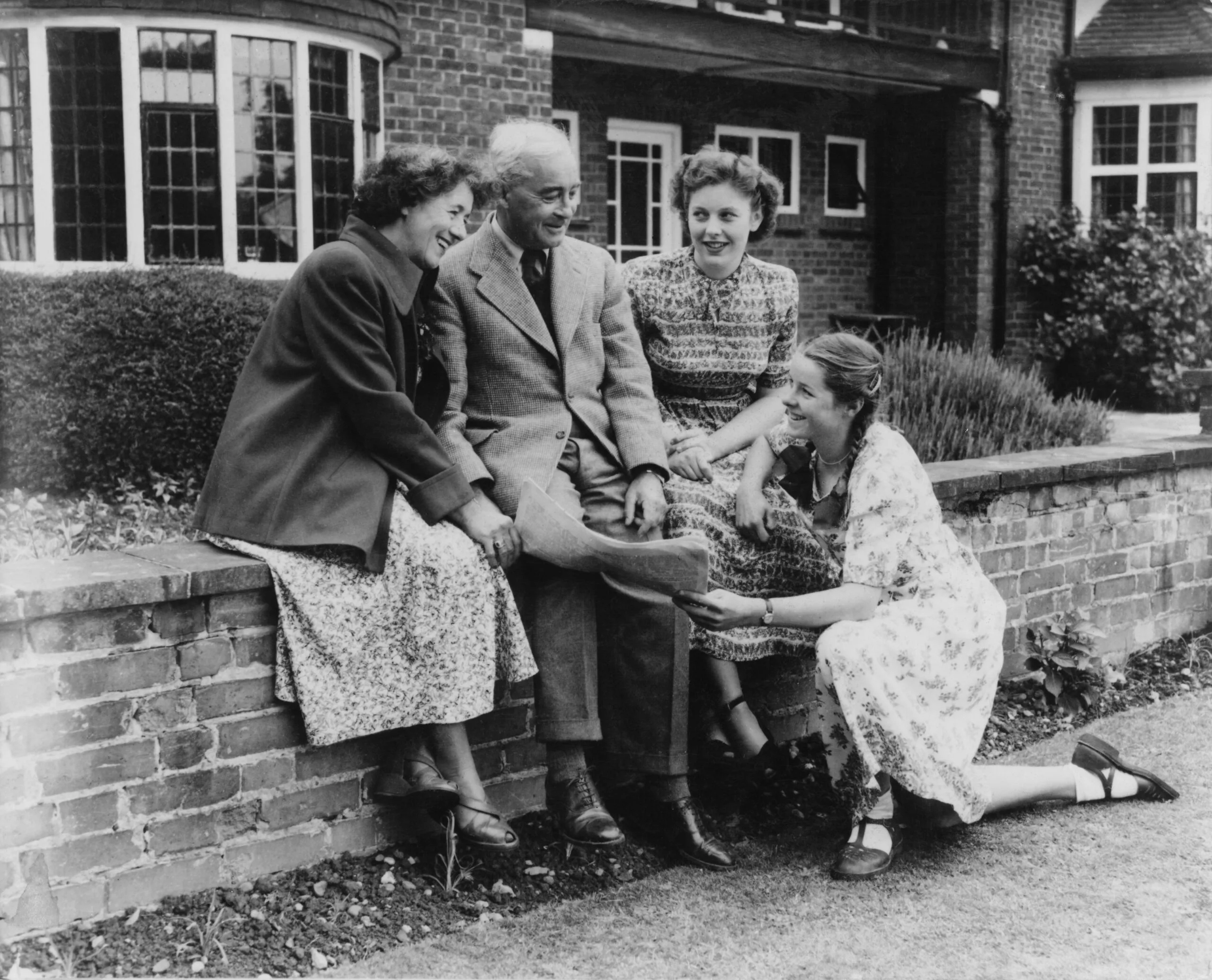 English children's writer Enid Blyton 1897 - 1968) with her husband Kenneth Waters and daughters Imogen and Gillian at their home in Beaconsfield, Buckinghamshire, 1949. (Photo by George Konig/Keystone Features/Hulton Archive/Getty Images)