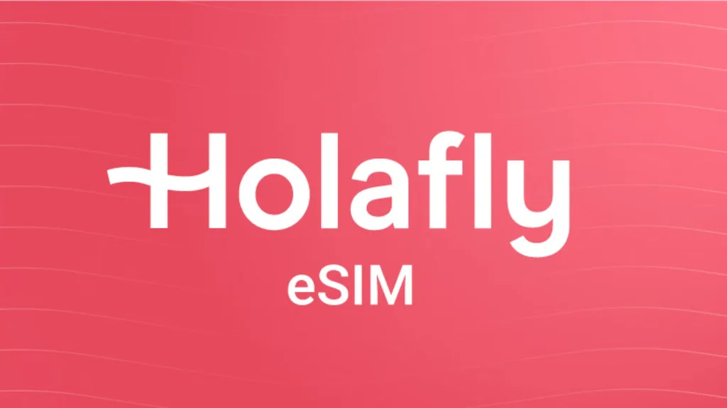 Promotional graphic featuring the white Holafly eSIM brand logo centered against a bright reddish-pink background with subtle wavy lines.