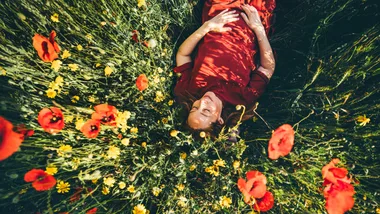 woman in bed of flowers