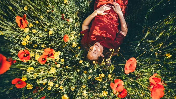 woman in bed of flowers