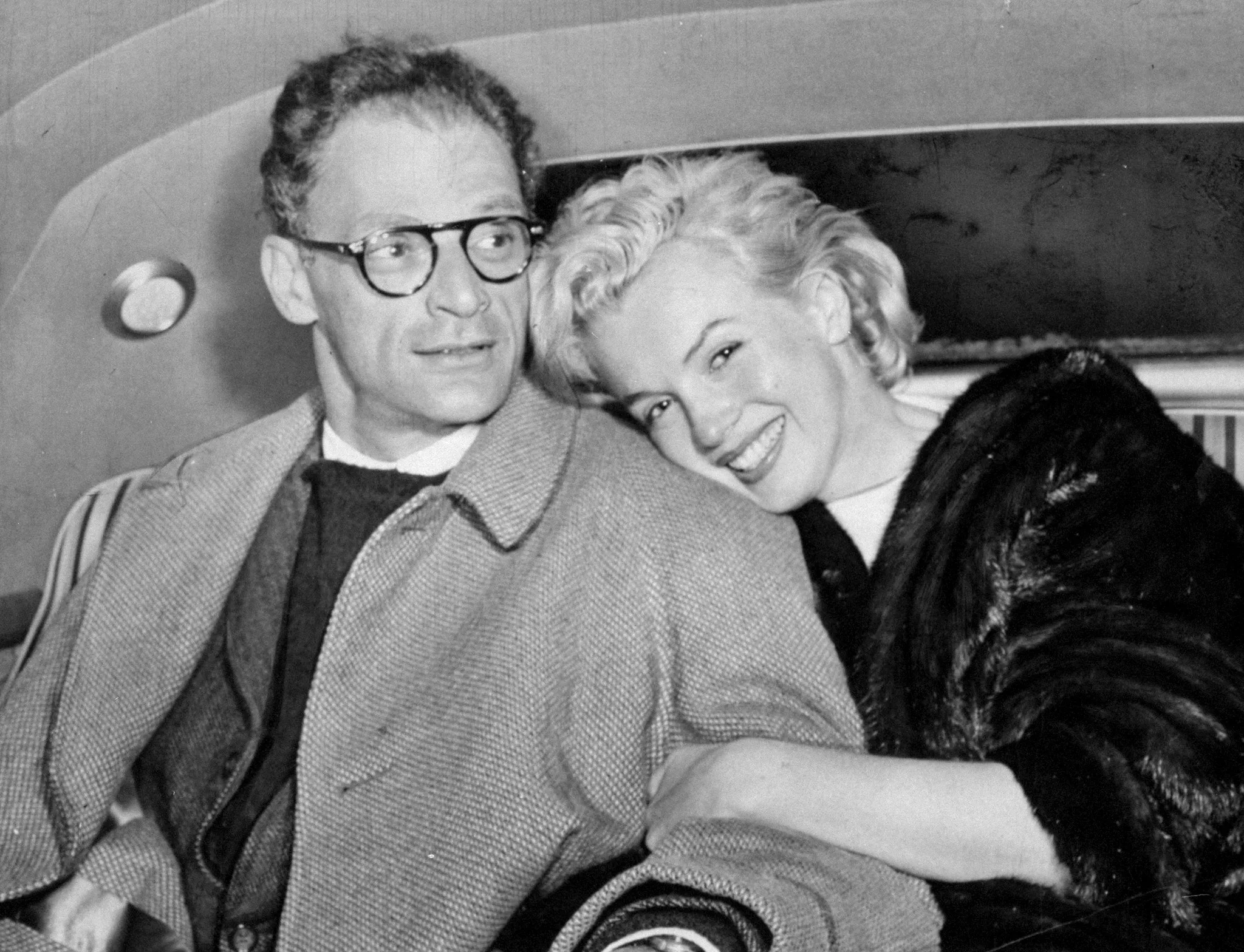 UNITED STATES - JANUARY 07:  Marilyn Monroe and husband Arthur Miller in car at Idlewild Airport after arriving from Kingston, Jamaica.  (Photo by Jack Clarity/NY Daily News Archive via Getty Images)