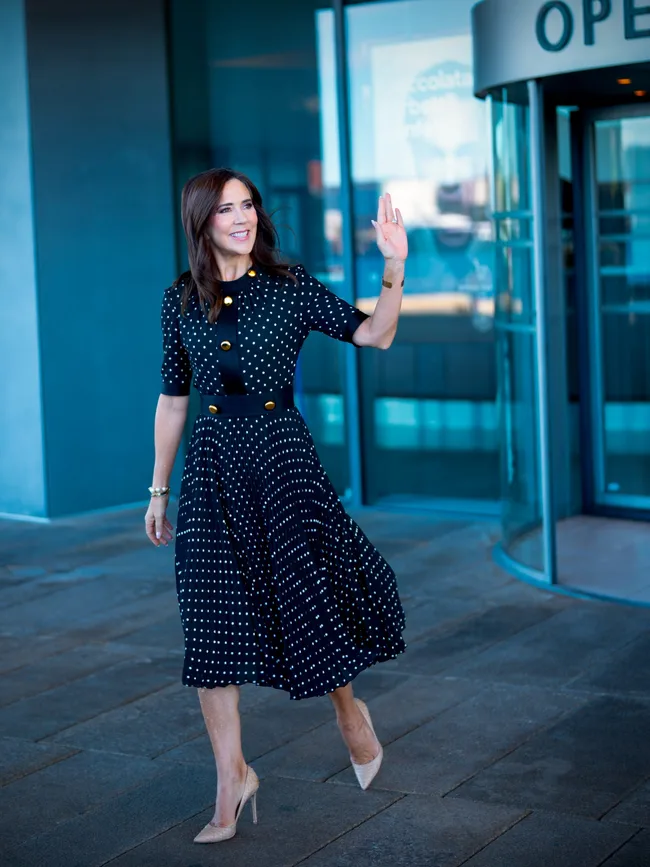 Queen Mary in polkadot mid length dress handing out education awards 2026