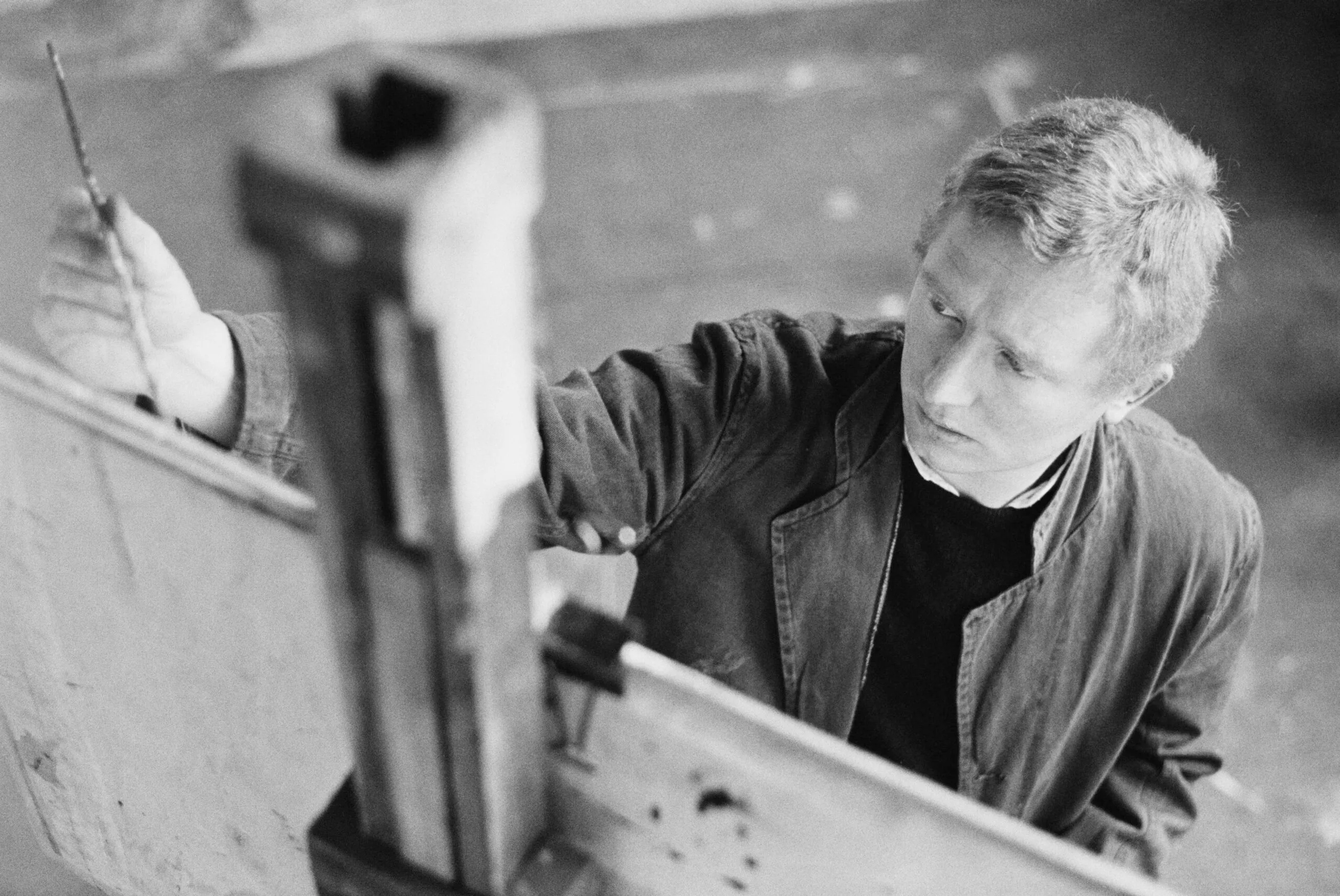Australian painter and sculptor Brett Whiteley (1939 - 1992) at work in a studio, circa 1965. (Photo by Tony Evans/Getty Images)