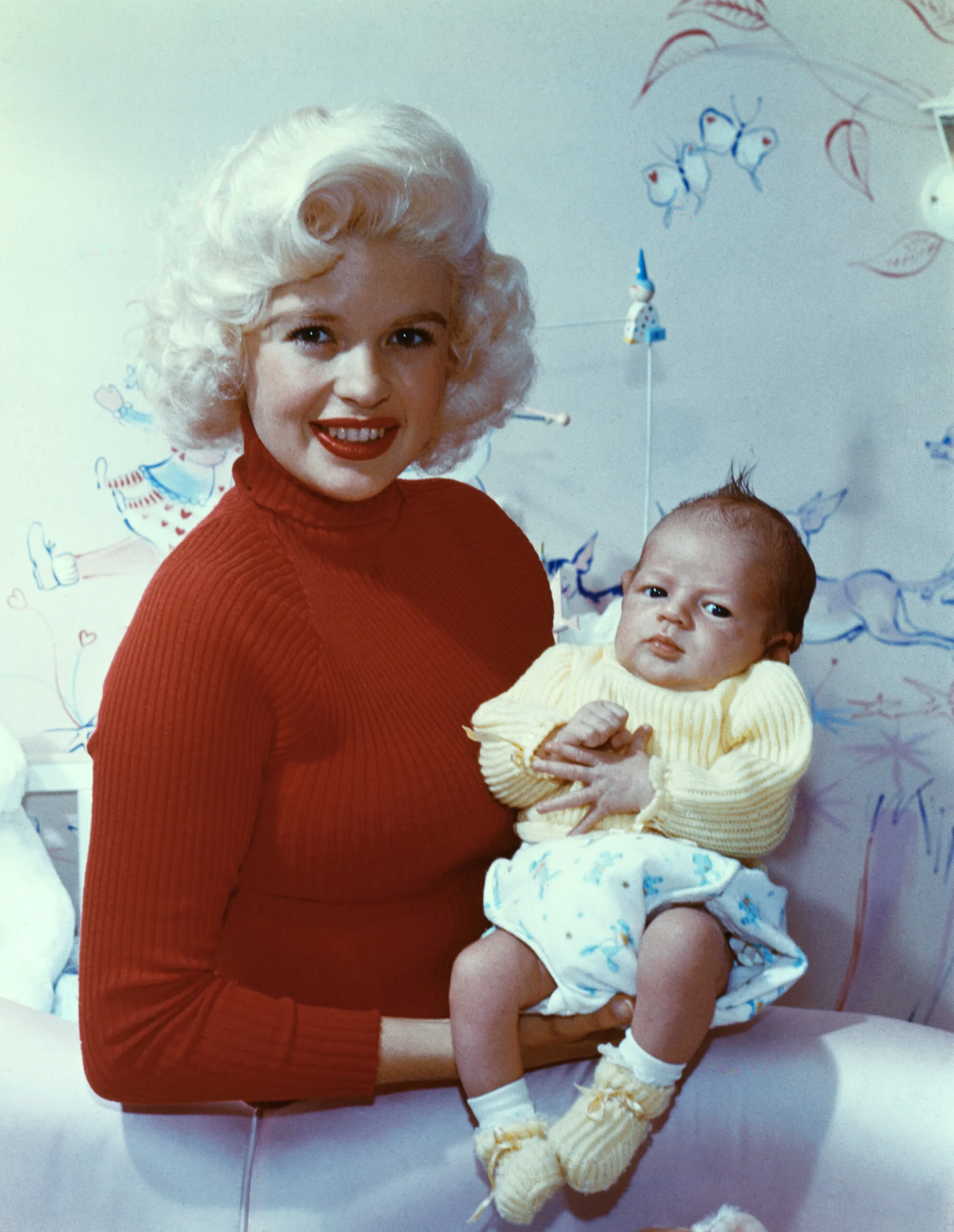 American movie actress and sex symbol Jayne Mansfield smiles while holding her son Miklos Hargitay. Source: Getty Images