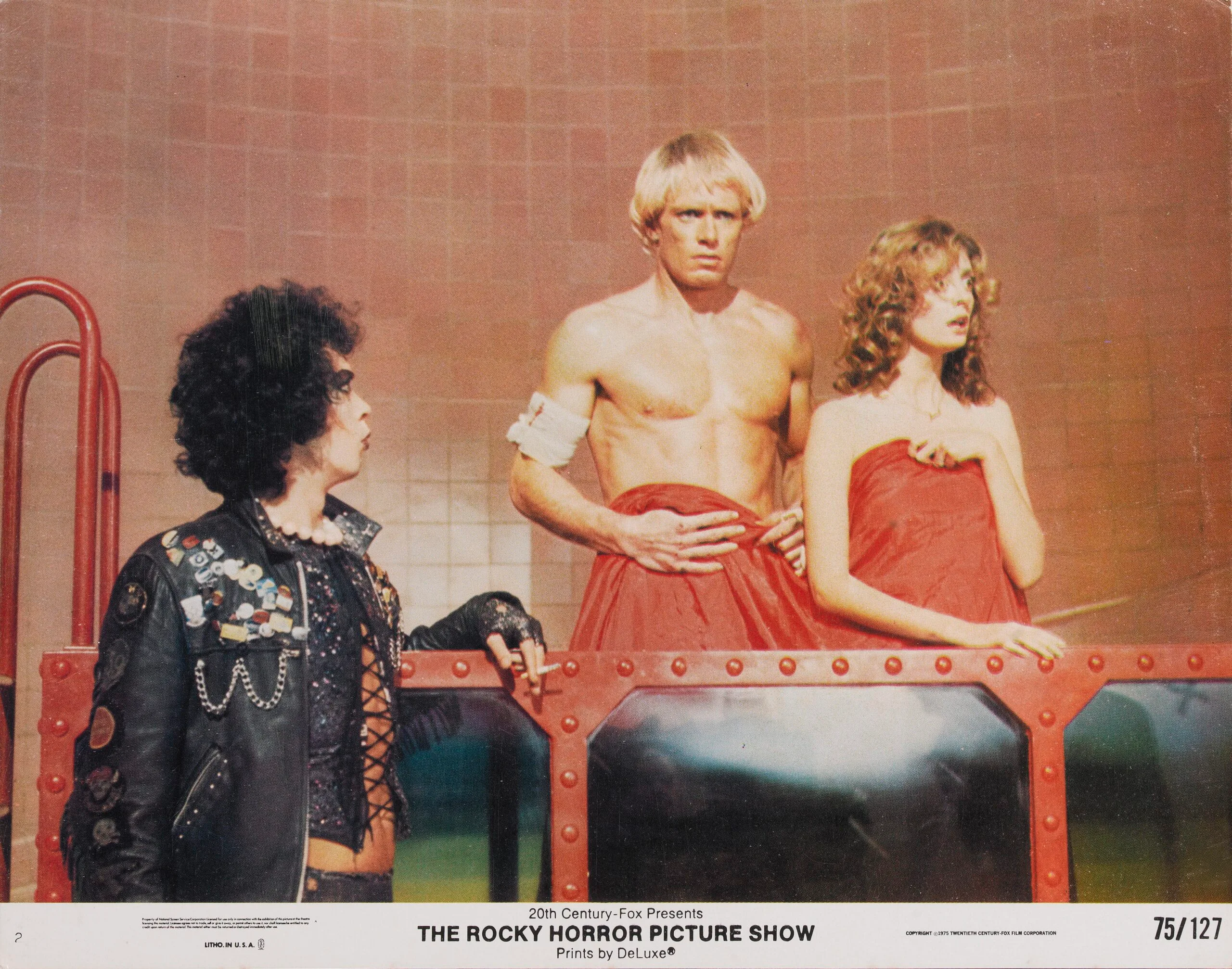 From left to right, actors Tim Curry, Peter Hinwood and Susan Sarandon as Dr Frank-N-Furter, Rocky Horror and Janet Weiss respectively, on a lobby card from the 1975 musical comedy 'The Rocky Horror Picture Show', produced by 20th Century Fox. (Photo by Movie Poster Image Art/Getty Images)
